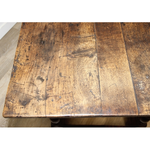 5 - A 17th century and later oak refectory table with turned legs and stretchers, the base likely 17th c... 