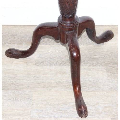 65 - An antique mahogany coat stand with reeded pillar and carved with wheat sheaths, five brass hooks an... 