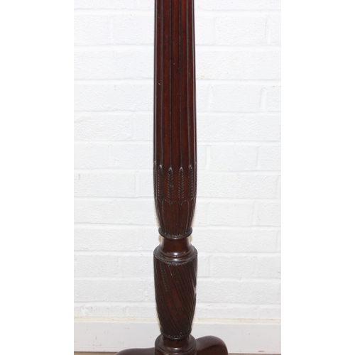 65 - An antique mahogany coat stand with reeded pillar and carved with wheat sheaths, five brass hooks an... 