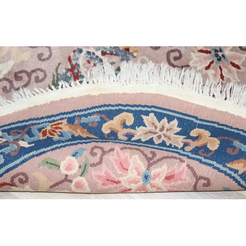 211 - Two circular Chinese wool rugs, one salmon ground, the other russet, each 140cm in diameter [2]