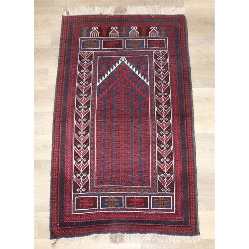 212 - A vintage Afghan Balucch prayer rug of red ground, 155cm x 86cm