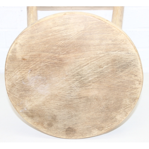 56 - Two rustic pine low stools, each 46cm tall