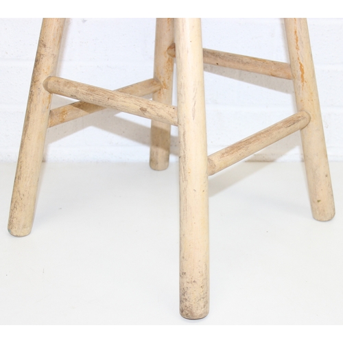 56 - Two rustic pine low stools, each 46cm tall