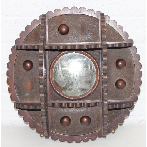 285 - An antique wall-mountable wooden shelf with central convex mirror and carved floral decoration, like... 