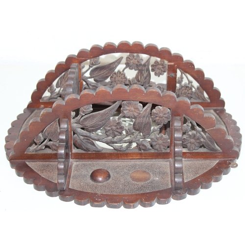 285 - An antique wall-mountable wooden shelf with central convex mirror and carved floral decoration, like... 