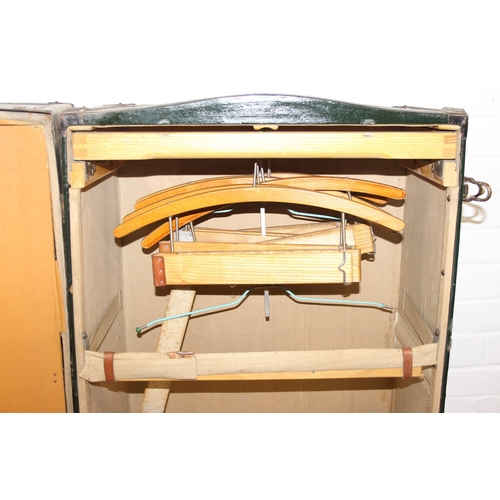 20 - Campaign wardrobe trunk with various travel stickers, approx 60cm x 54cm x 131cm