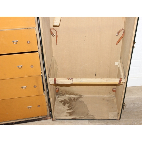 20 - Campaign wardrobe trunk with various travel stickers, approx 60cm x 54cm x 131cm