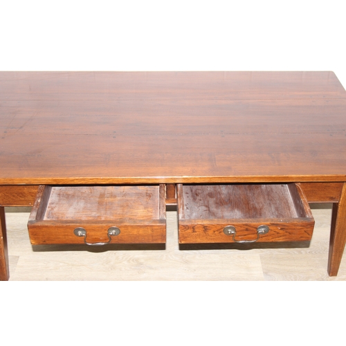 68 - A modern three planked oak coffee table with 2 drawers either side, approx 140cm x75cm x 51cm
