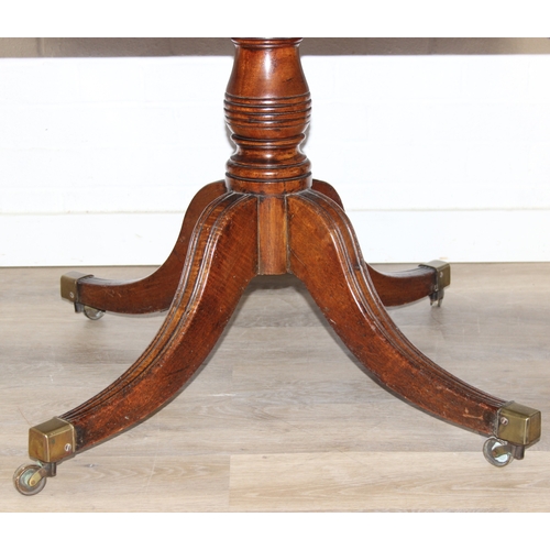 106 - Regency period mahogany drop leaf table with pedestal, splayed base and 4 drawers, 81cm (136cm exten... 