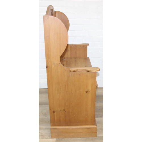 55 - A vintage pine settle or hall seat with storage box seat, carved details, 91cm x 43cm x 109cm