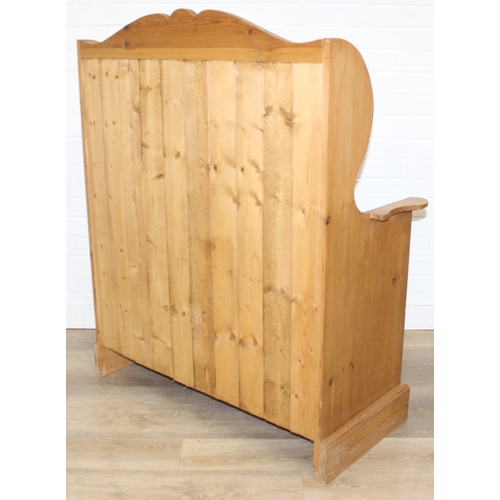55 - A vintage pine settle or hall seat with storage box seat, carved details, 91cm x 43cm x 109cm