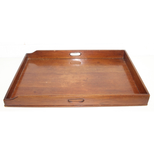 184 - A vintage mahogany butler's serving tray on folding stand, 75cm x 49cm x 86cm