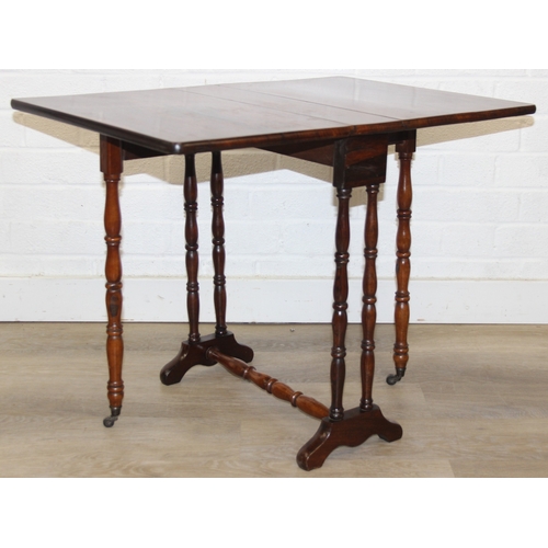 107 - An antique rosewood Sutherland dropleaf table with turned legs, 69cm x 49cm x 53cm when open