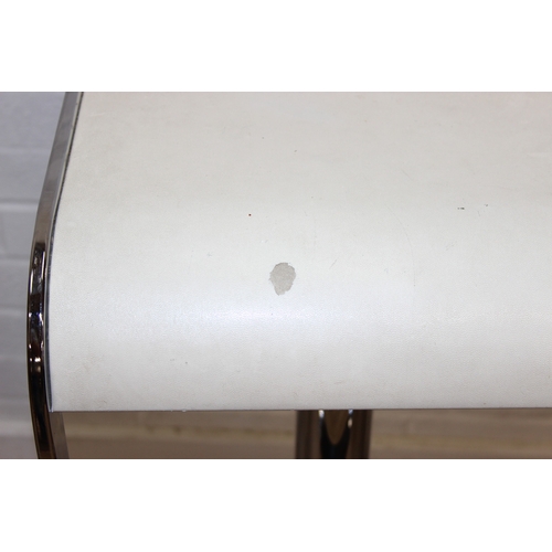 27 - A pair of retro style chrome and white leather effect bar stools by Dwell, in the manner of LEM stoo... 