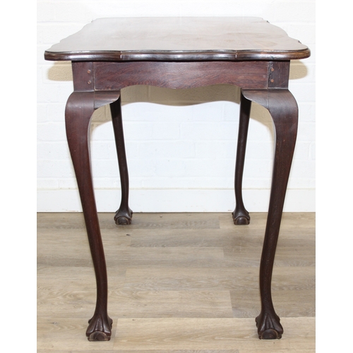 64 - A small wooden table with wavy edge and ball and claw feet, unknown wood with prominent grain, possi... 