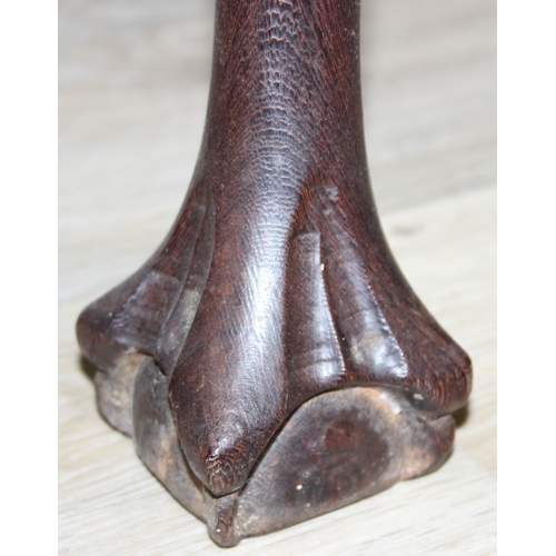 64 - A small wooden table with wavy edge and ball and claw feet, unknown wood with prominent grain, possi... 