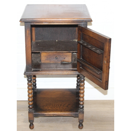 63 - A vintage oak cabinet with fitted interior for holding smoking pipes and a vintage wooden magazine r... 