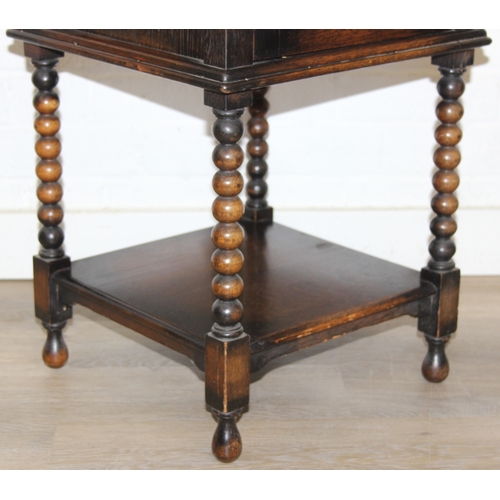 63 - A vintage oak cabinet with fitted interior for holding smoking pipes and a vintage wooden magazine r... 