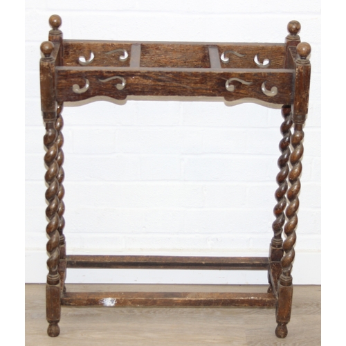 41 - An antique oak stick or umbrella stand with carved details, early 20th century, 60cm x 23cm x 76cm
