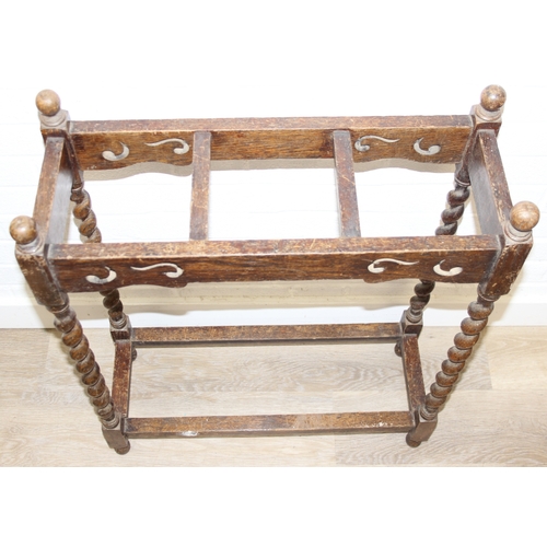 41 - An antique oak stick or umbrella stand with carved details, early 20th century, 60cm x 23cm x 76cm