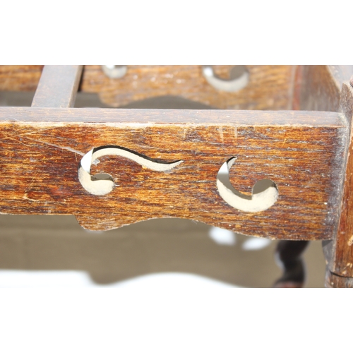 41 - An antique oak stick or umbrella stand with carved details, early 20th century, 60cm x 23cm x 76cm