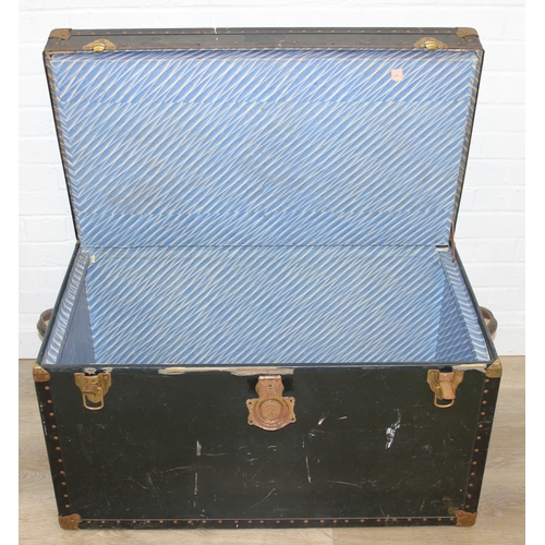 191 - Two large vintage travelling trunks with brass bound corners and studded details, largest 92cm x 52c... 