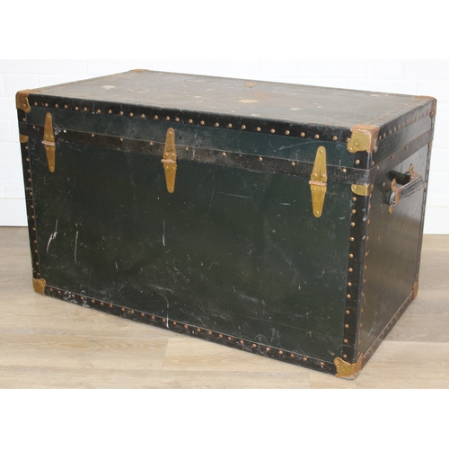 191 - Two large vintage travelling trunks with brass bound corners and studded details, largest 92cm x 52c... 