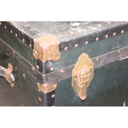 191 - Two large vintage travelling trunks with brass bound corners and studded details, largest 92cm x 52c... 