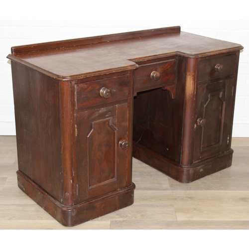 94 - A 19th century mahogany desk with three drawers and two cupboards, approx 120cm x 54cm x 74cm