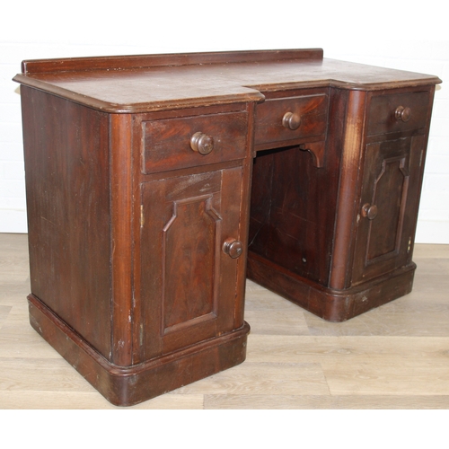 94 - A 19th century mahogany desk with three drawers and two cupboards, approx 120cm x 54cm x 74cm