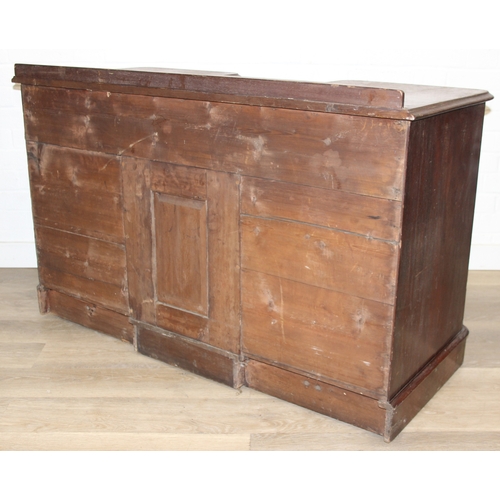 94 - A 19th century mahogany desk with three drawers and two cupboards, approx 120cm x 54cm x 74cm