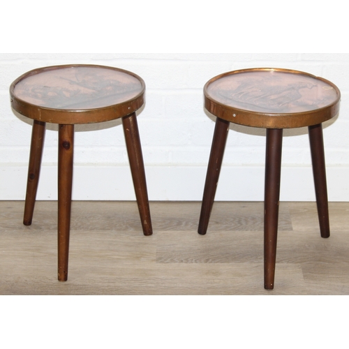 76 - A pair of vintage stools or side table with embossed copper tops showing scenes of African animals, ... 