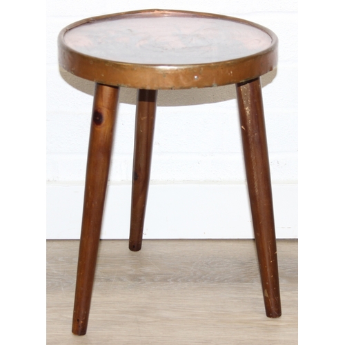 76 - A pair of vintage stools or side table with embossed copper tops showing scenes of African animals, ... 