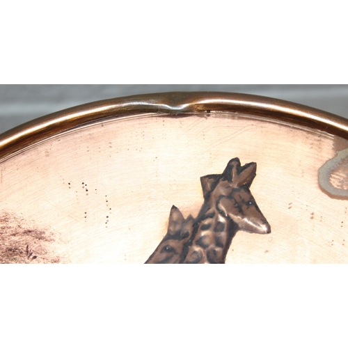 76 - A pair of vintage stools or side table with embossed copper tops showing scenes of African animals, ... 