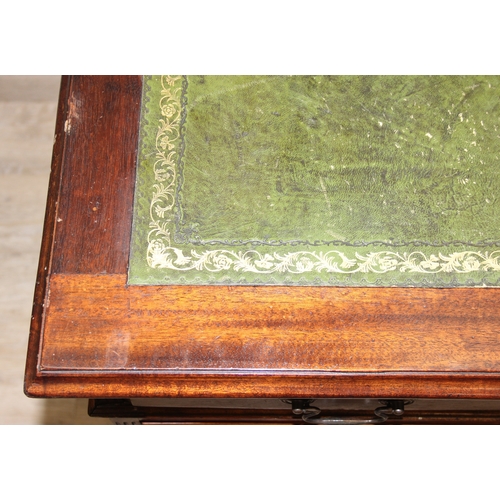 186 - A vintage mahogany partner's three-part pedestal desk with inset green leather top, eighteen drawers... 