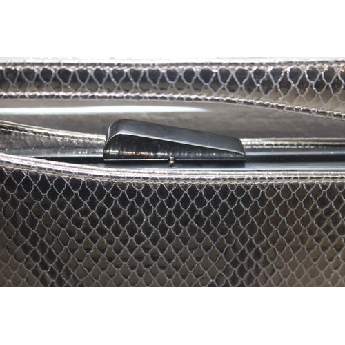 217 - Stuart Weitzman ladies' evening snap-shut clutch bag in metallic snakeskin style finish, 30cm W