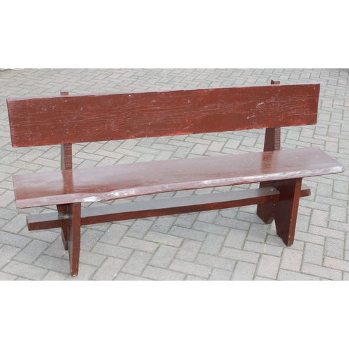 315 - A rustic stained wooden garden bench, two plank construction, 153cm wide
