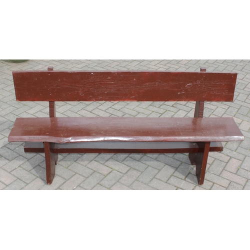 315 - A rustic stained wooden garden bench, two plank construction, 153cm wide
