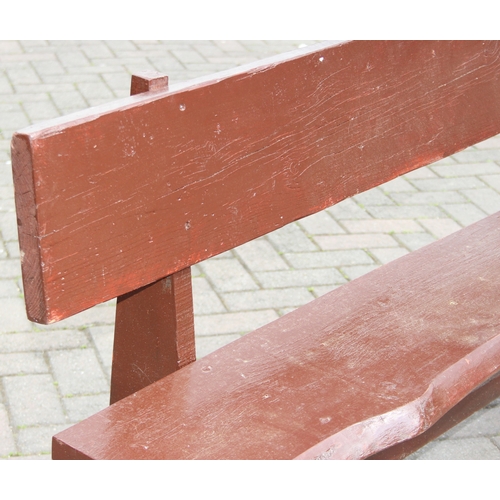 315 - A rustic stained wooden garden bench, two plank construction, 153cm wide