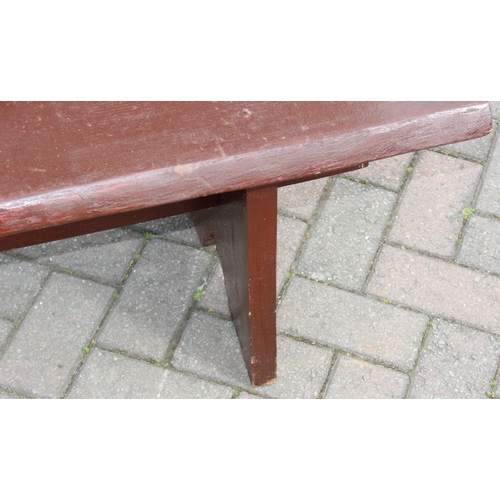 315 - A rustic stained wooden garden bench, two plank construction, 153cm wide