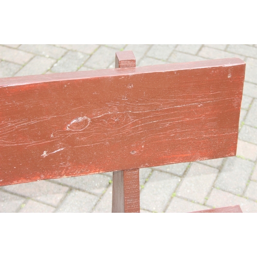 315 - A rustic stained wooden garden bench, two plank construction, 153cm wide