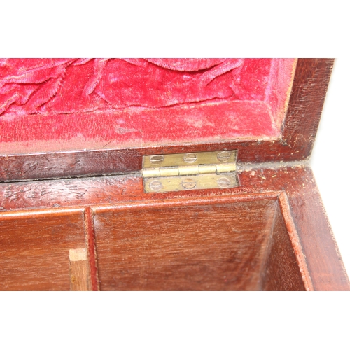 293 - An antique mahogany sarcophagus tea caddy with turned feet and ring handles, three compartment inter... 