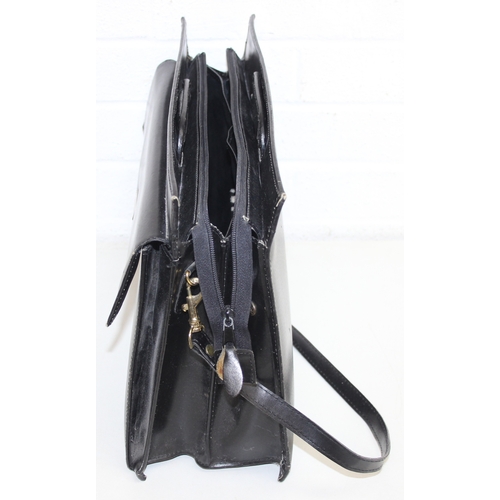 218 - 2 vintage leather bags to incl a black satchel style/briefcase hand bag and a cream and beige larges... 