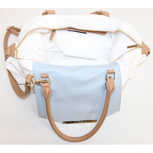 218 - 2 vintage leather bags to incl a black satchel style/briefcase hand bag and a cream and beige larges... 