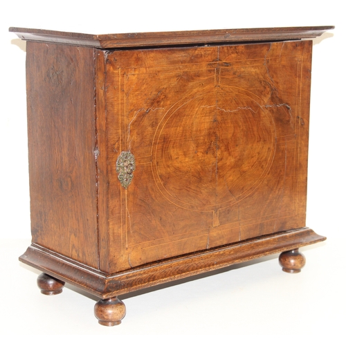 289 - An antique oak and walnut with sycamore banding spice cupboard, in part Queen Anne period c.1700 wit... 
