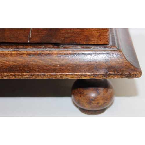 289 - An antique oak and walnut with sycamore banding spice cupboard, in part Queen Anne period c.1700 wit... 