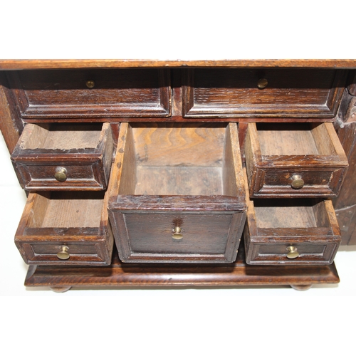 289 - An antique oak and walnut with sycamore banding spice cupboard, in part Queen Anne period c.1700 wit... 