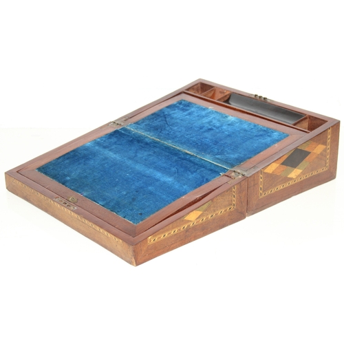 292 - A Victorian parquetry wooden writing slope with geometric marquetry inlaid details, blue velvet lini... 