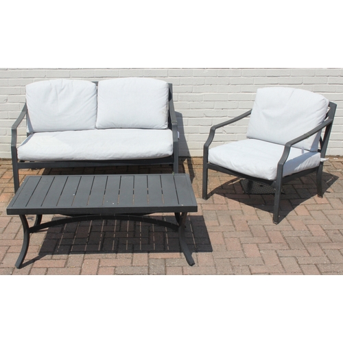 314 - A modern aluminium garden set comprising of a two seater sofa and a chair with cushions, and a small... 