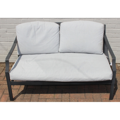 314 - A modern aluminium garden set comprising of a two seater sofa and a chair with cushions, and a small... 
